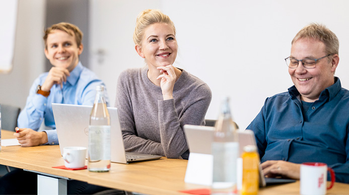 Cheerful People Listening to a Seminar
