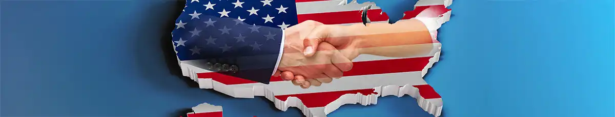 Handschlag vor der US-Flagge