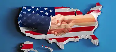 Landkarte USA mit Fahne und sich schüttelnden Händen