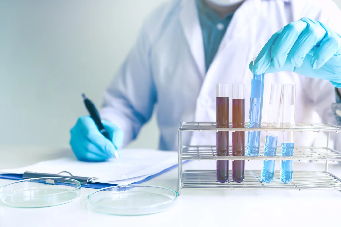 Scientist working at an analyser in the laboratory.