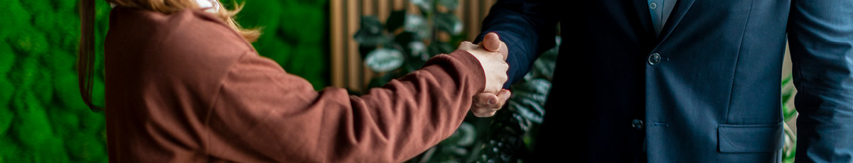 Man and woman shake hands