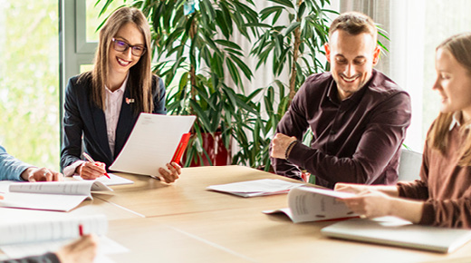 Team Analyzing Documents in the Office